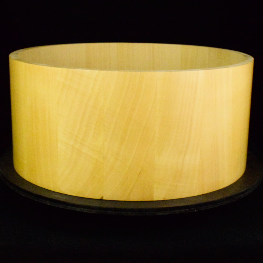 Snare drum shell made from maple staves
