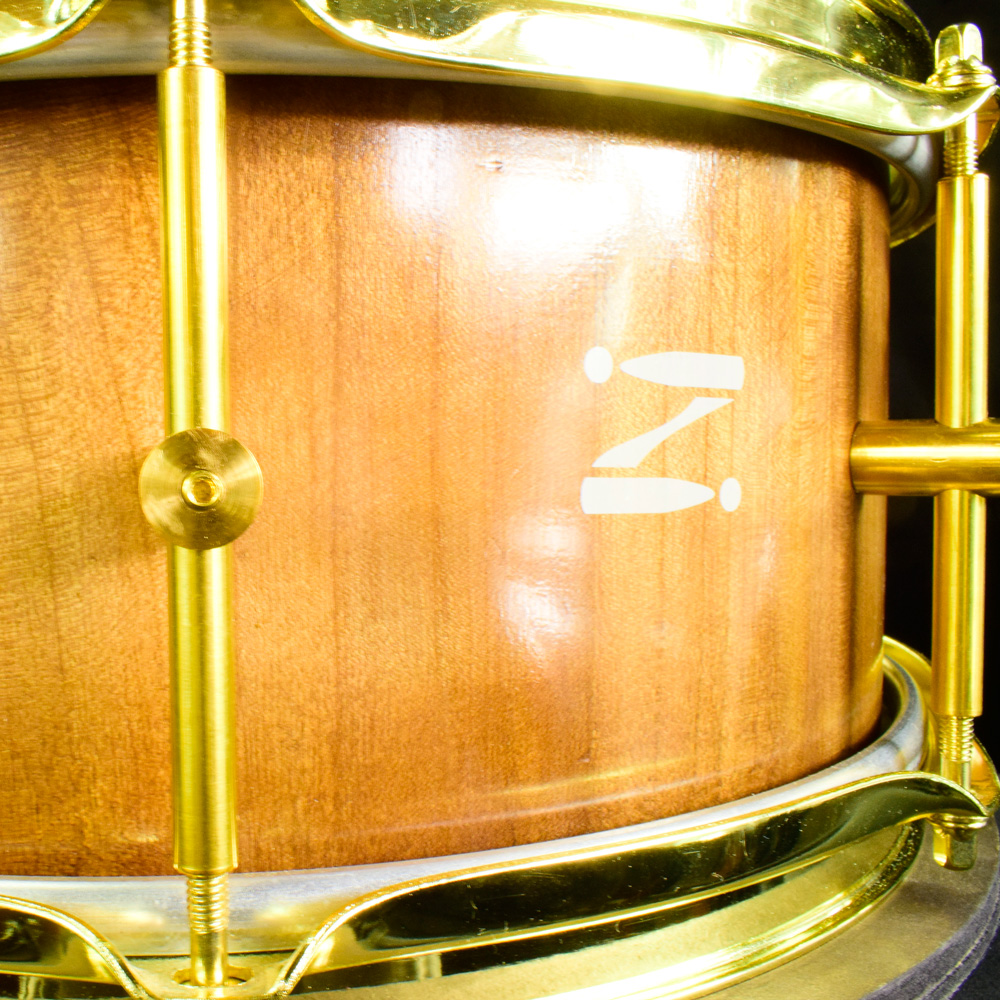 Cherry stave snare drum with brass hardware