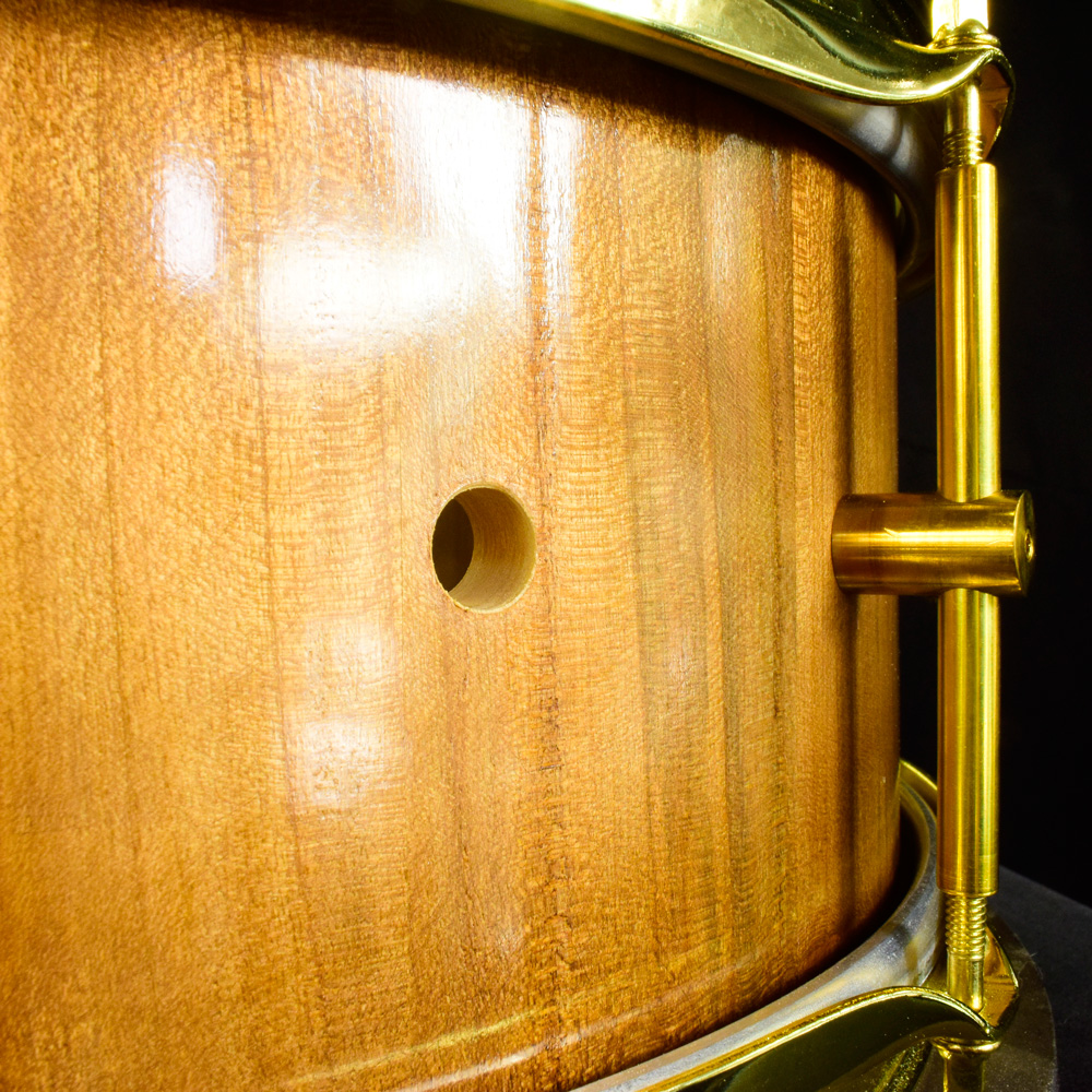 Cherry stave snare drum with brass hardware